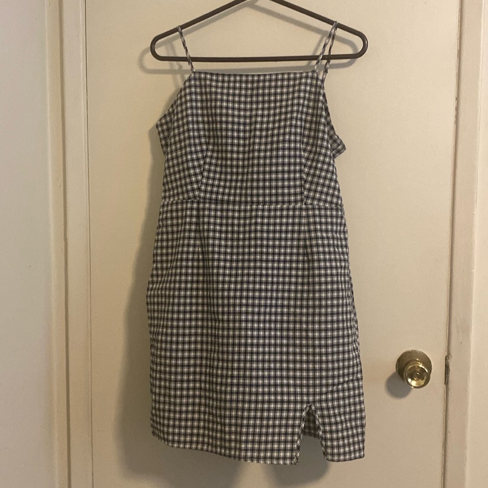 Black and white plaid mini dress, spaghetti straps.